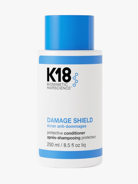 K18 Damage Shield pH Protective Conditioner in branded bottle component on a light gray background